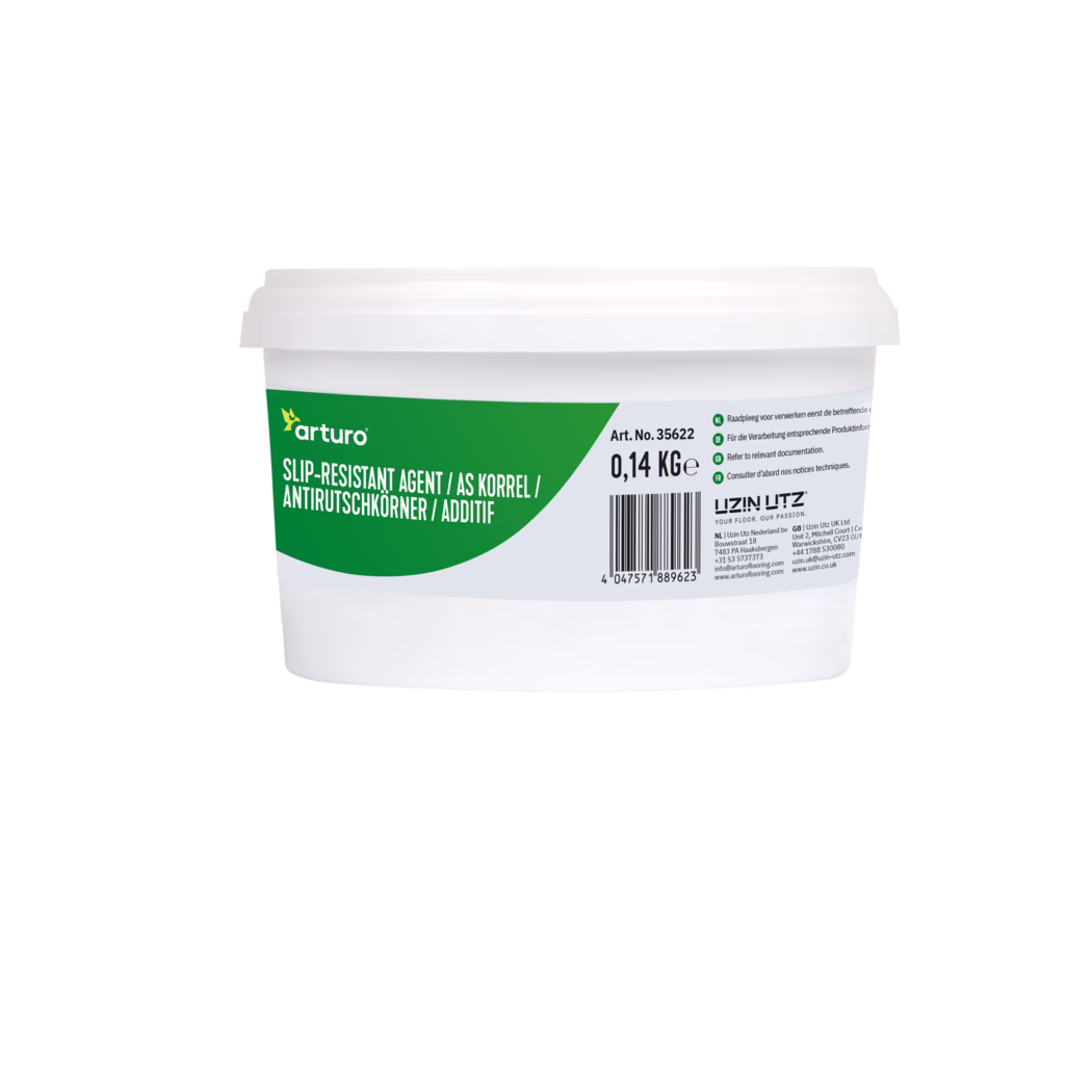 Arturo_Dummy_slip-resistant agent-0,1375kg_2022-05 Close-up of the upper half of a white plastic tub with a green and grey Arturo label reading "Slip-Resistant Agent" and showing 0.14 kg, a barcode and small multilingual instructions; the container sits against a plain white background.