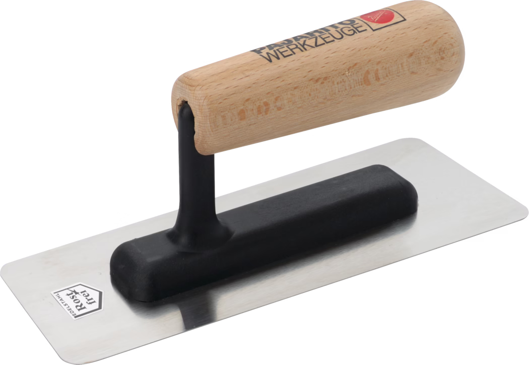 Pajarito_Dummy_Marble effect trowel wooden handle_013668_013669_013670_2021-03 Close-up of a rectangular stainless-steel plastering trowel with a polished flat blade and slightly rounded corners. It features a black molded plastic mounting and a vertical shank supporting a smooth, rounded wooden handle with a natural finish and a printed brand logo. The tool is clean and photographed on a white background and is intended for smoothing plaster, mortar or render on walls and ceilings. Visible details include the reflective metal blade, the black cushioning base that secures the handle, and the wood grain of the handle.